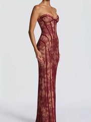 Burgundy lace sweetheart neckline maxi dress with corset detail and sheer overlay.