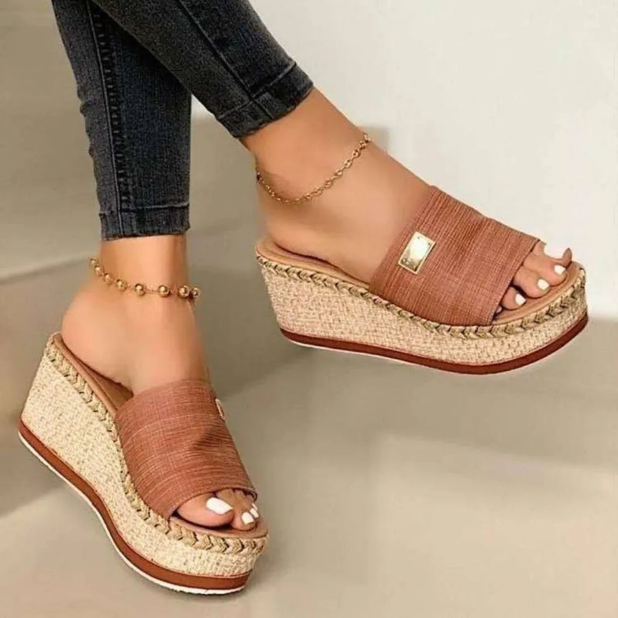 Caramel textured platform slides with metallic detail and espadrille wedge.