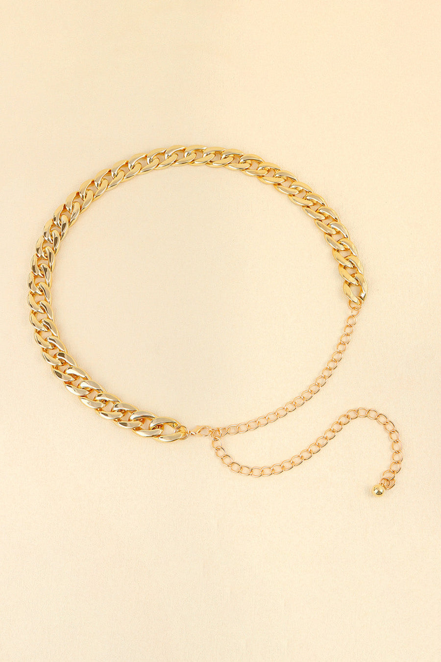 Gold chunky curb chain belt with adjustable extender chain and ball end.