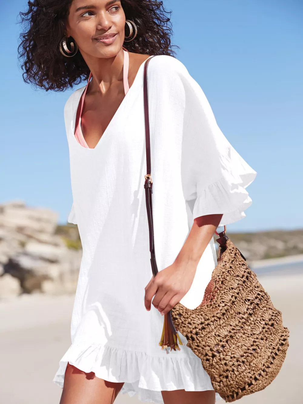 White ruffled V-neck beach cover-up with breezy bell sleeves and hem.