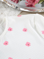 White ribbed knit pajama top with pink floral print and frill trim detail.