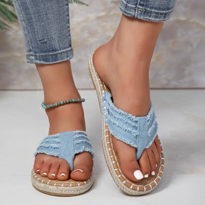 Pastel blue frayed denim espadrille thong sandals with jute trim.