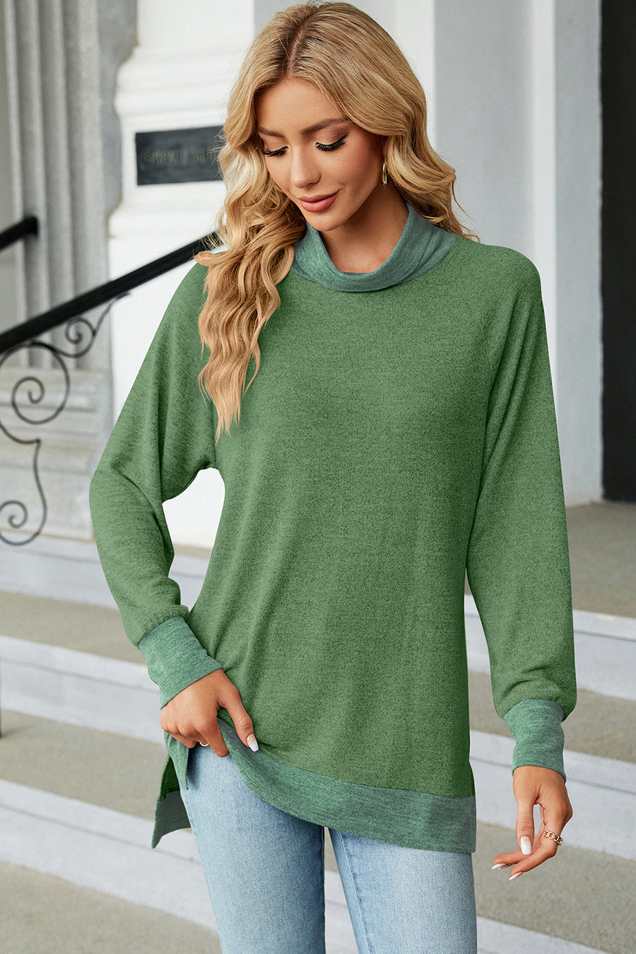 Colorblock raglan turtleneck tunic in green with contrasting trim and cuffs.