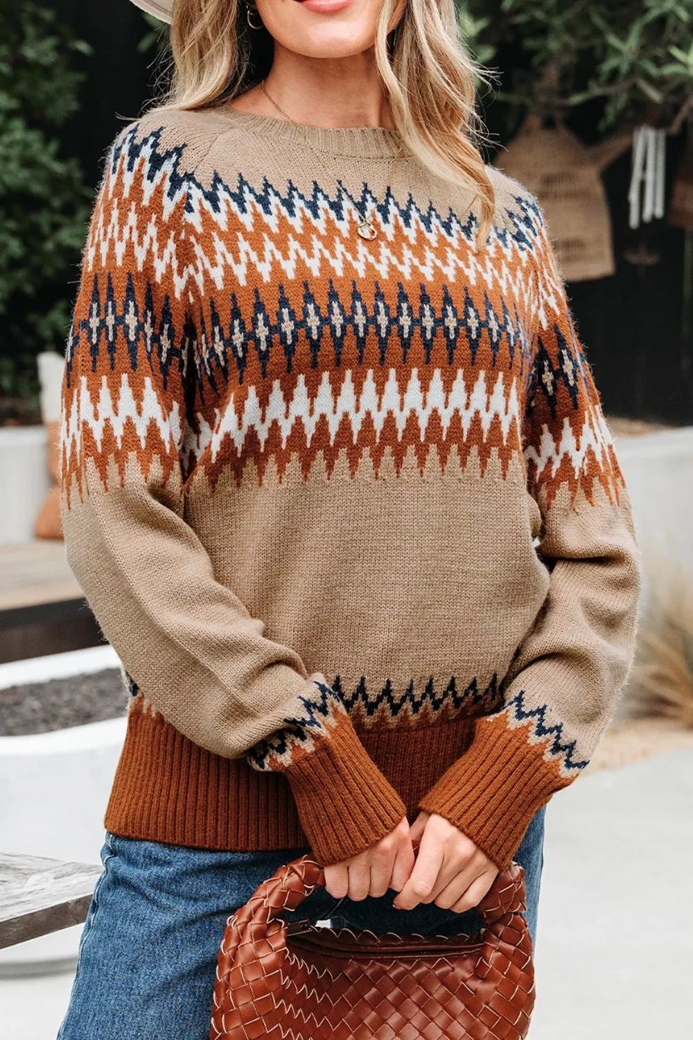 pullover sweater in rust with geometric and ribbed cuffs