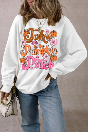 White long-sleeve sweatshirt with "Take Me to the Pumpkin Patch" graphic and floral accents.