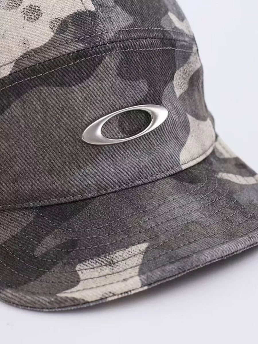 Oakley camouflage baseball cap with silver logo detail.