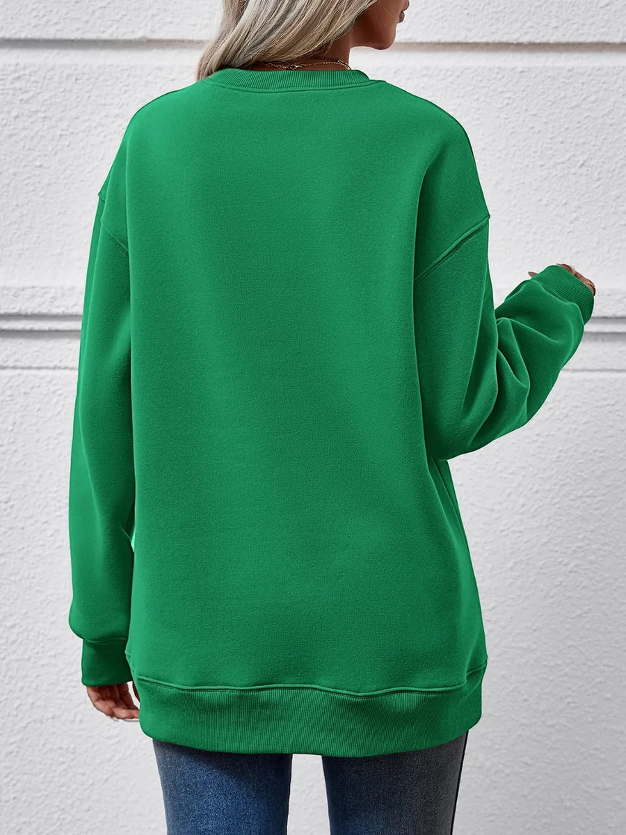 Green crewneck sweatshirt with crew neckline and long sleeves.