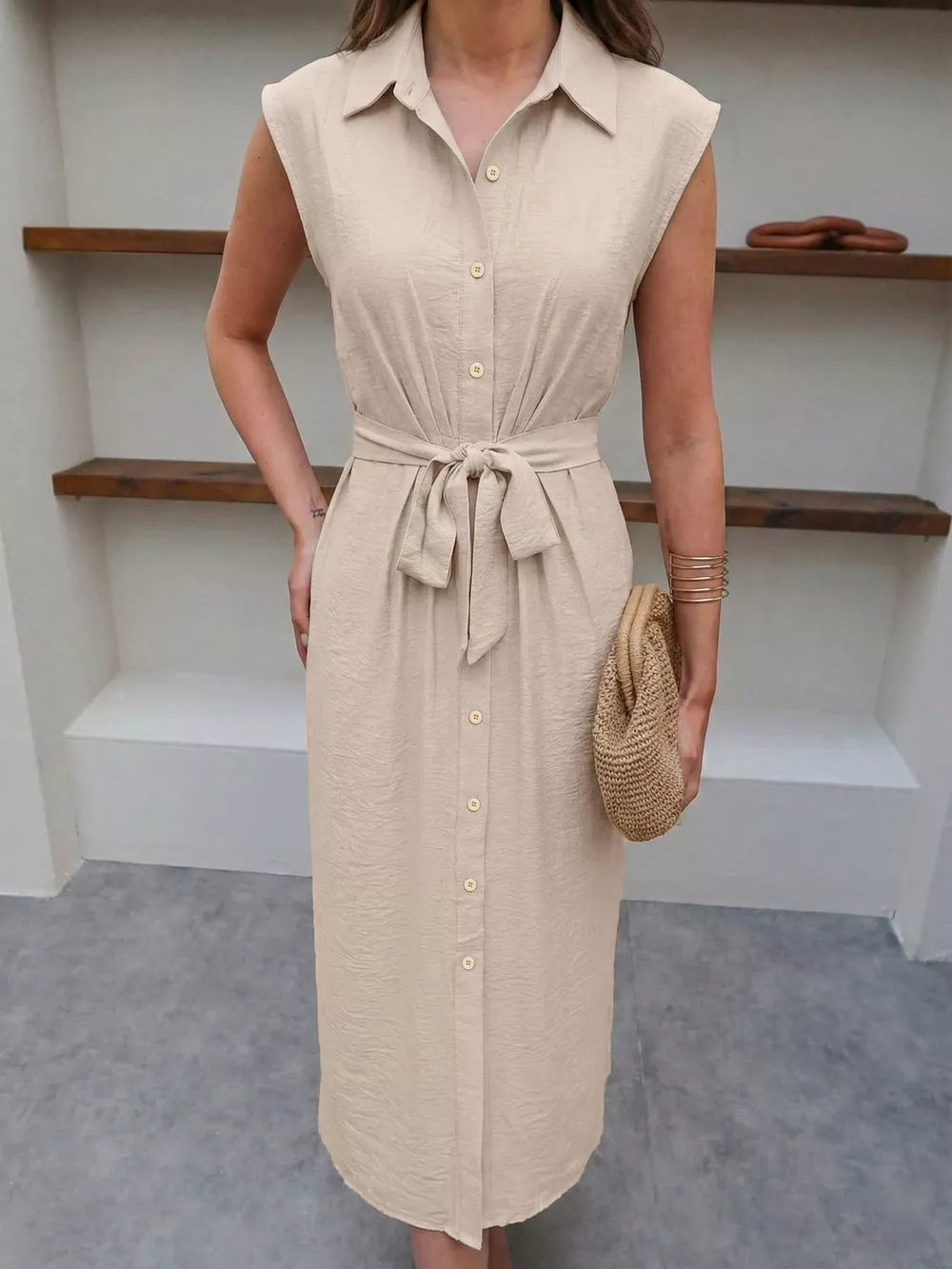 Beige midi shirt dress with tie-waist and button-down front.