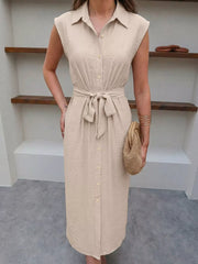 Beige midi shirt dress with tie-waist and button-down front.