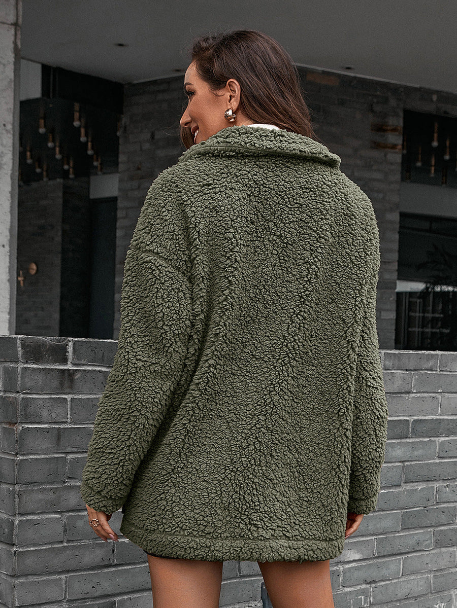 Green asymmetrical teddy moto jacket with a collared neckline and plush texture.