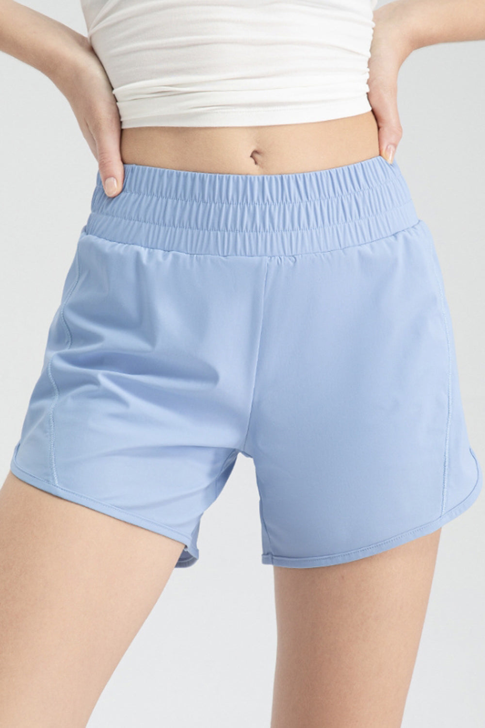Light blue layered performance running shorts with elastic waistband
