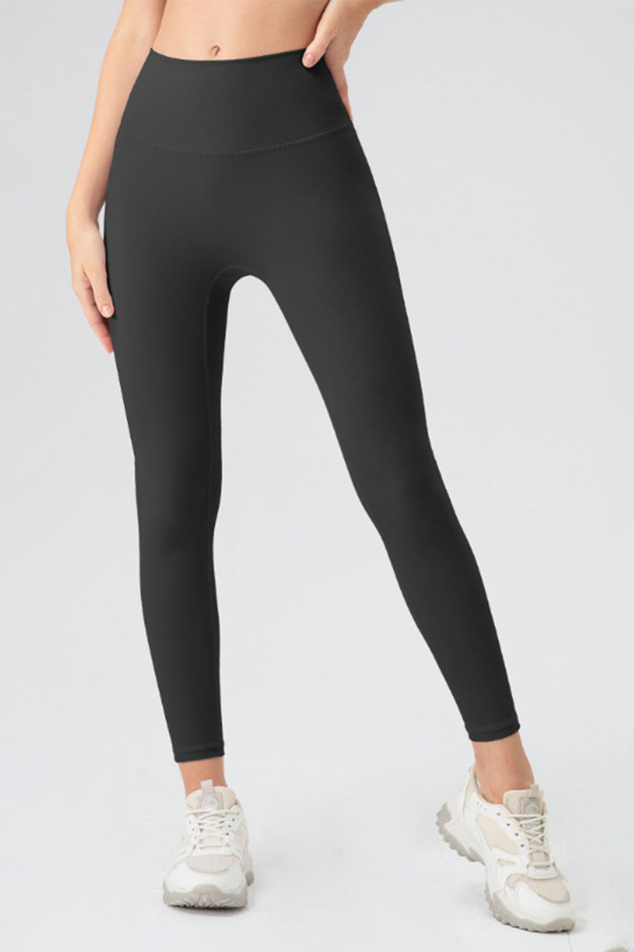 Black high rise leggings with a seamless waistband and full length legs.