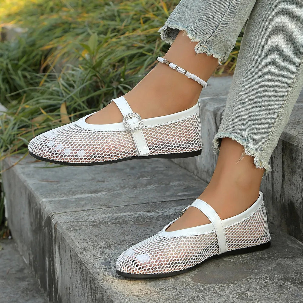 White mesh ballet flats with buckle detail and ankle strap.