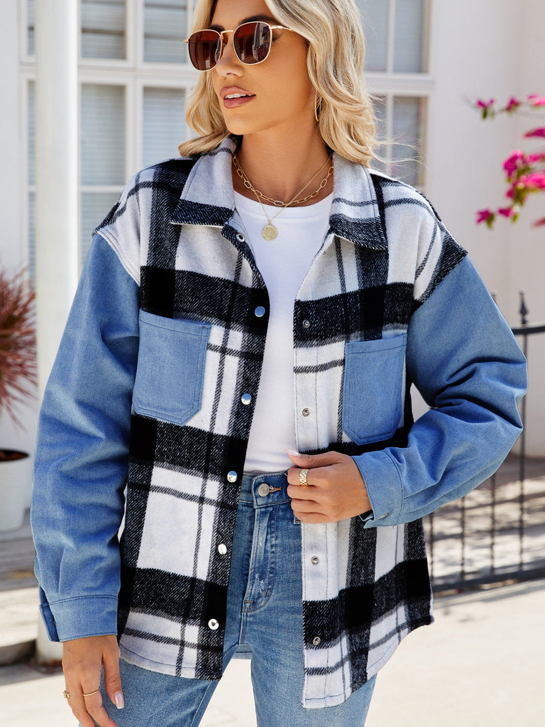 Colorblock plaid denim shacket in dusty blue with button front and chest pockets.