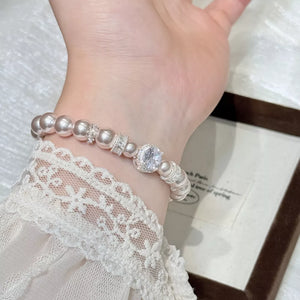 bracelet in lavender grey featuring pearl embellishment and fitted fit
