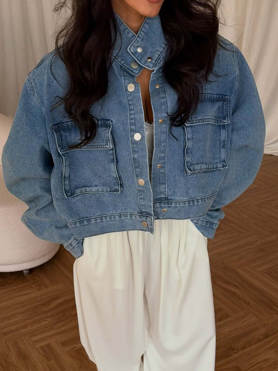 denim jacket in light blue featuring button-front and oversized fit