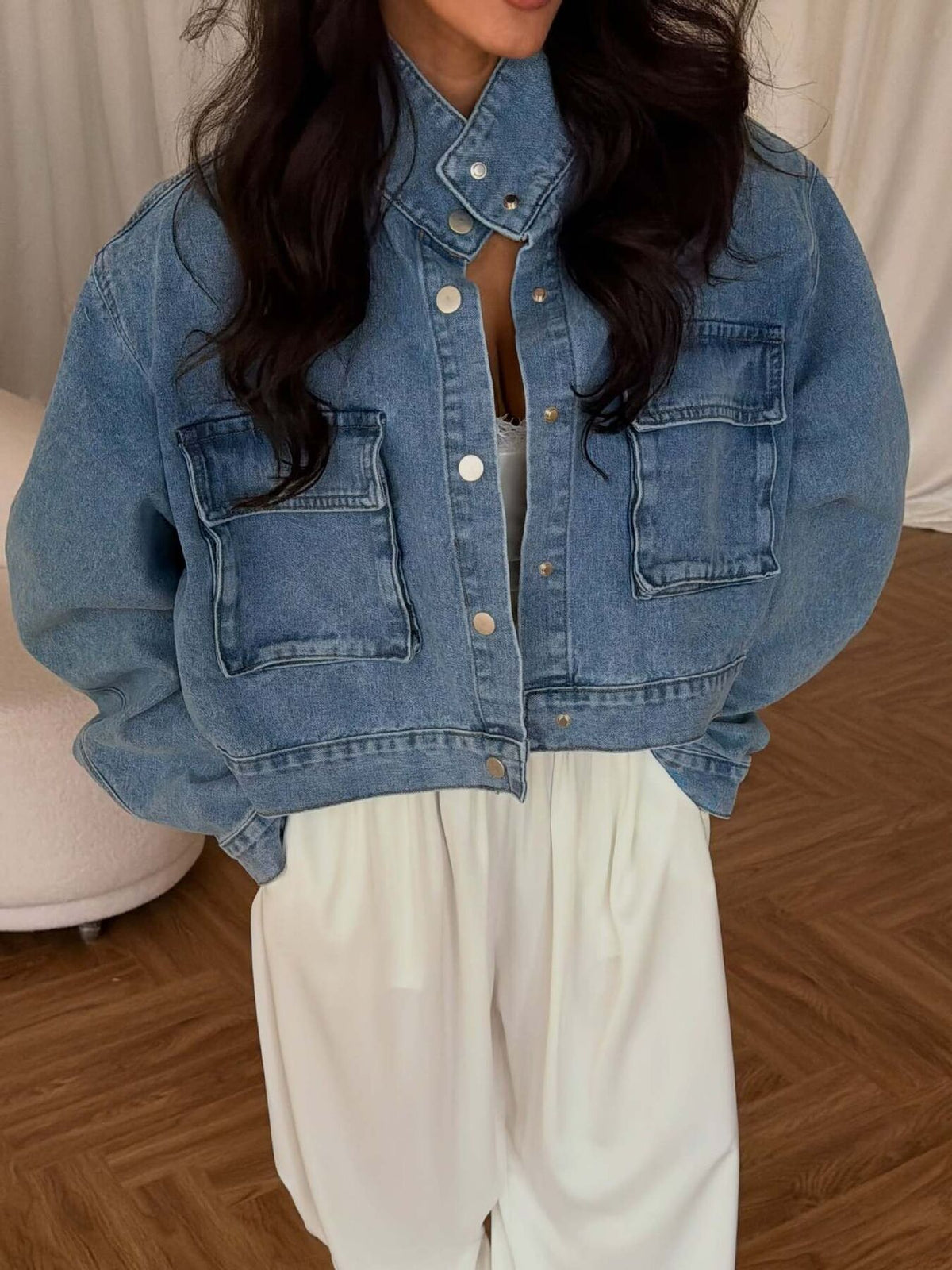 denim jacket in light blue featuring button-front and oversized fit