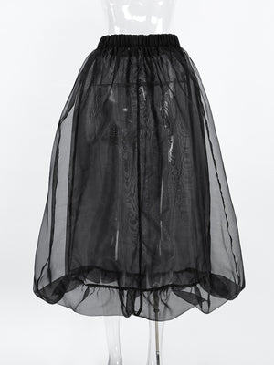 Black midi skirt with sheer overlay and ruffled hem