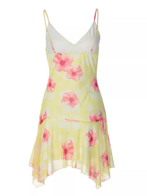 Yellow floral asymmetrical mini dress with ruffled hem and spaghetti straps.