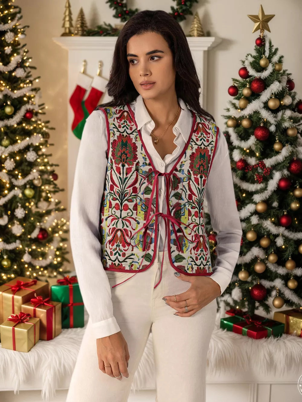 Embroidered tie-front cropped vest coat in white with red floral embroidery and trim.