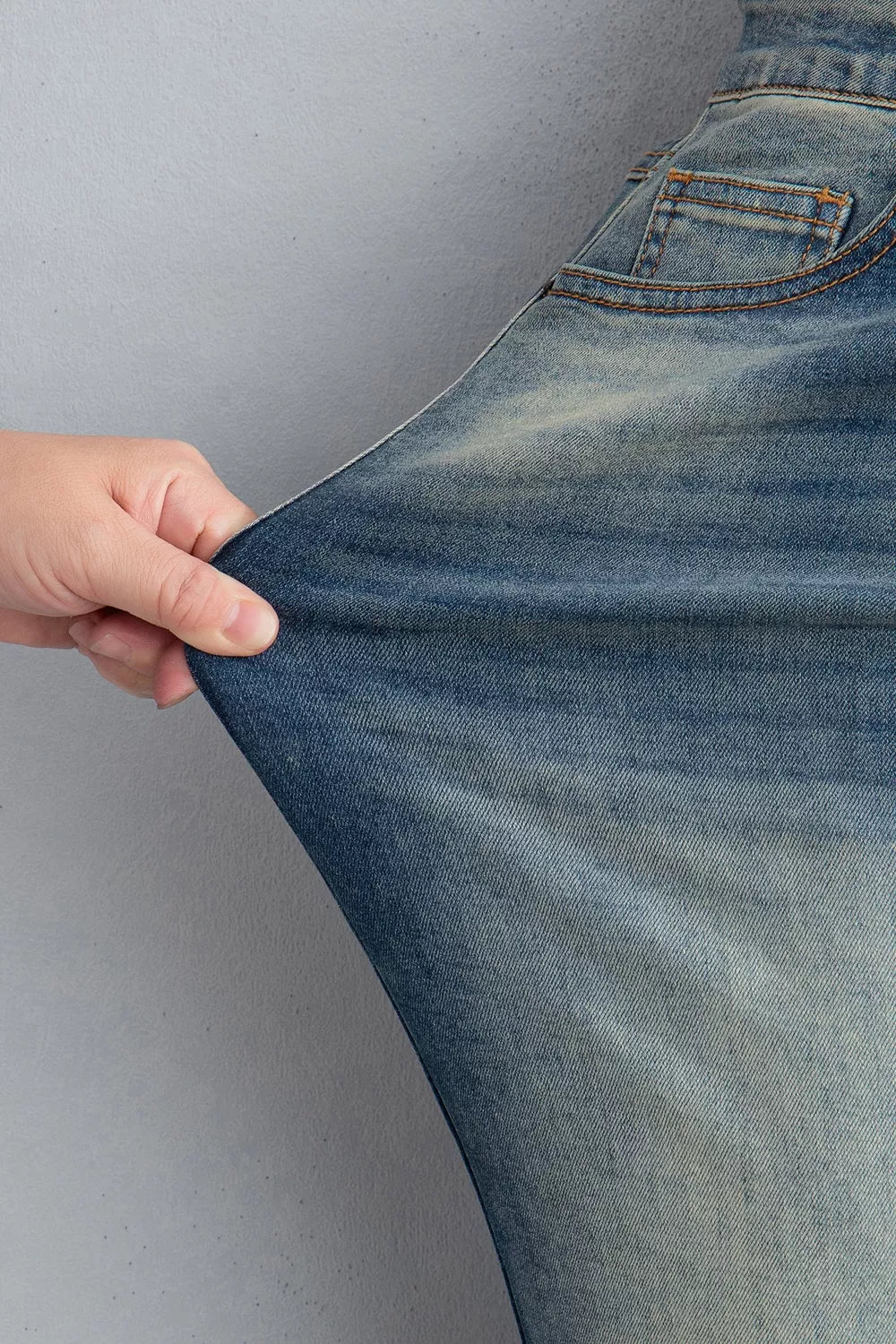 Pocket Detail Flare Leg Jeans in medium wash blue with pocketed