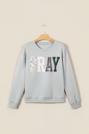 pullover sweater in light pink with patchwork and chenille patch