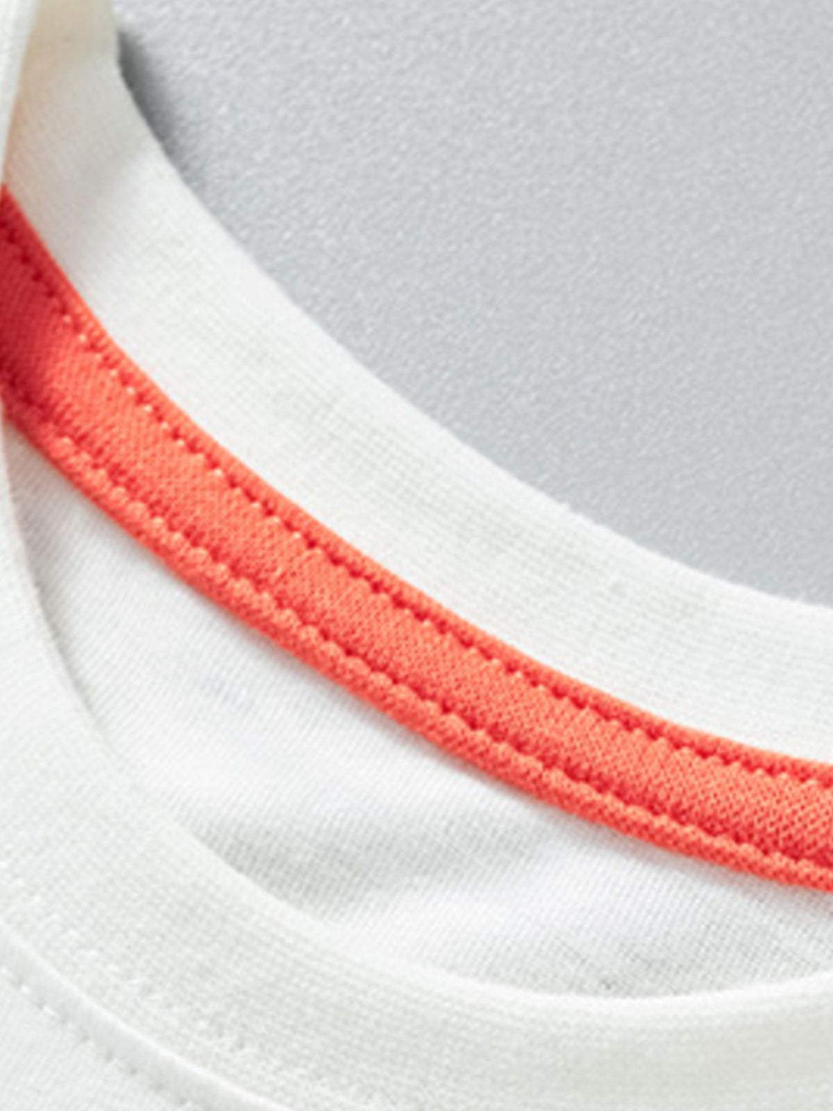 White cotton crew neck t-shirt with orange trim detail