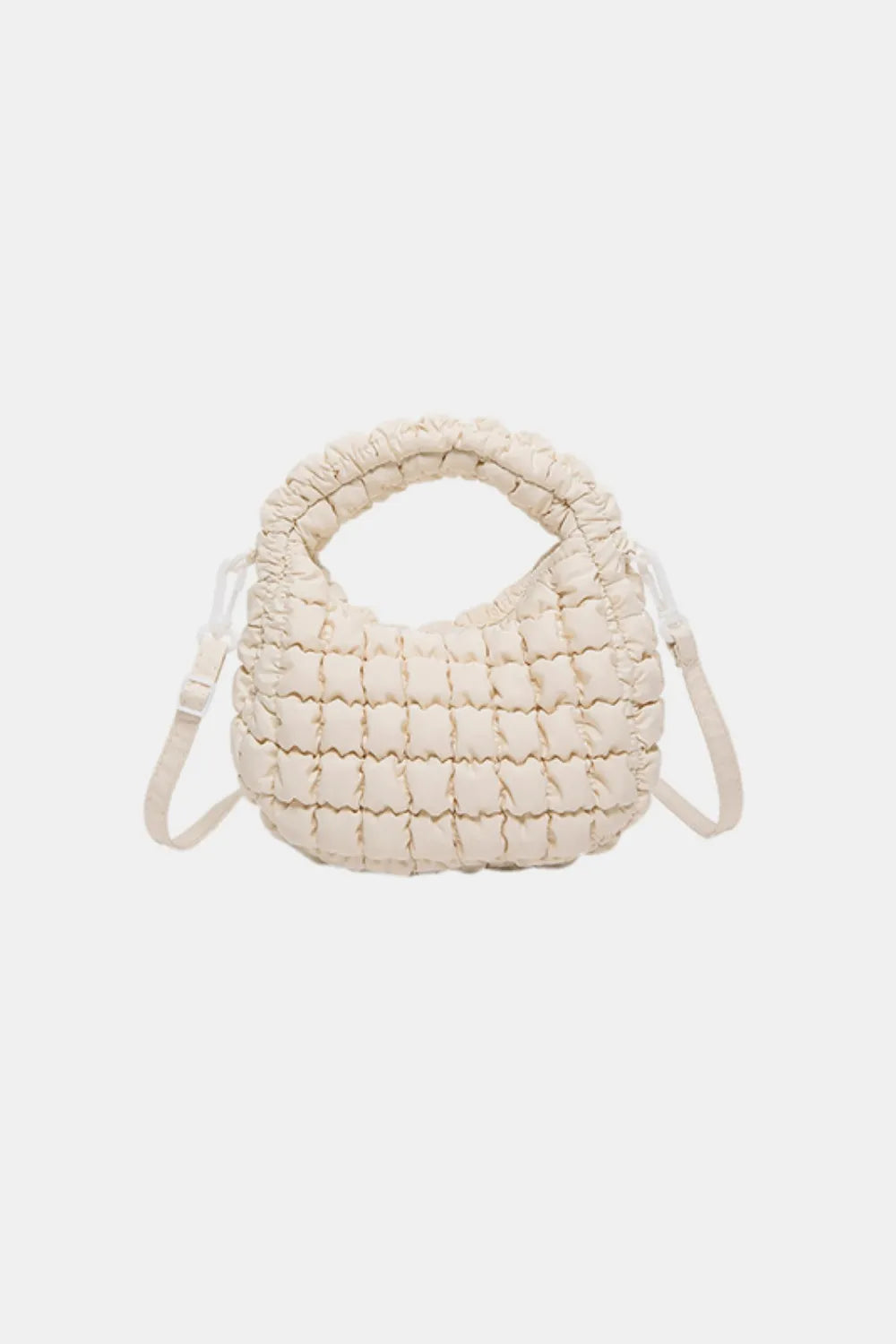 Padded crescent crossbody bag in ivory with sculptural texture and ruched handle.