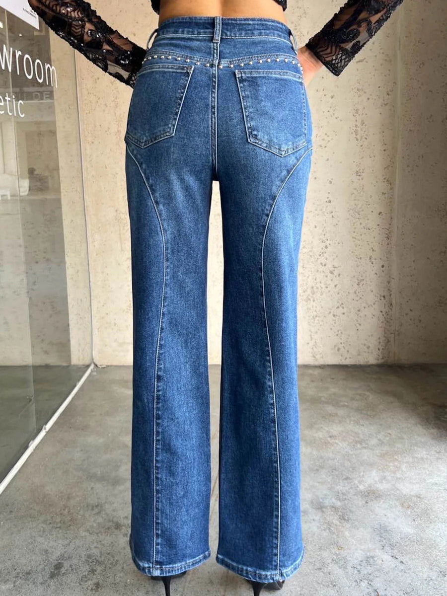 Studded high-waisted wide-leg jeans in dusty blue with seam detail and button fly.