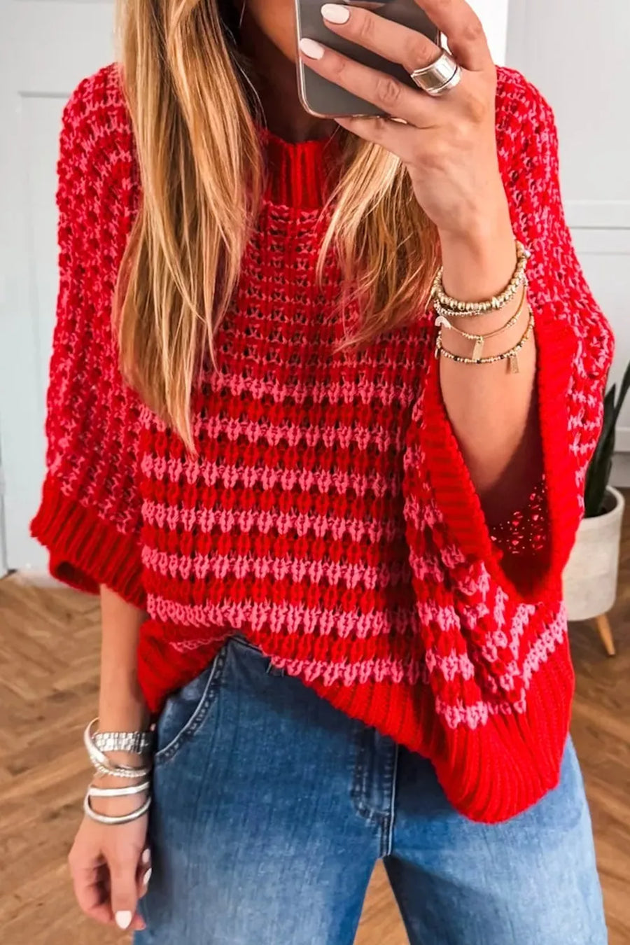 Red and pink striped crochet detail knit sweater with crew neck and wide sleeves.