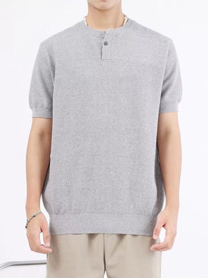 Men's gray knitted henley shirt with short sleeves and button placket.