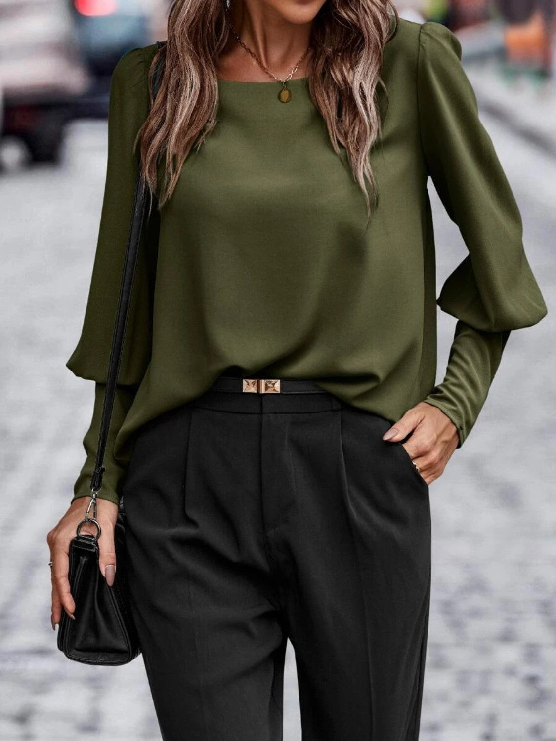 Button-back puff sleeve blouse in Black Forest green with a scoop neckline and long sleeves.