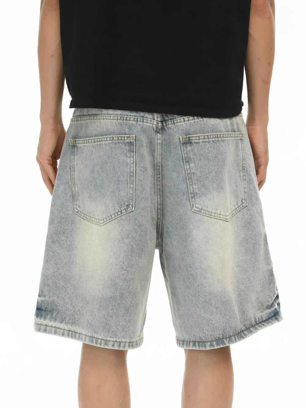Relaxed fit blue denim shorts with a light wash and distressed details.