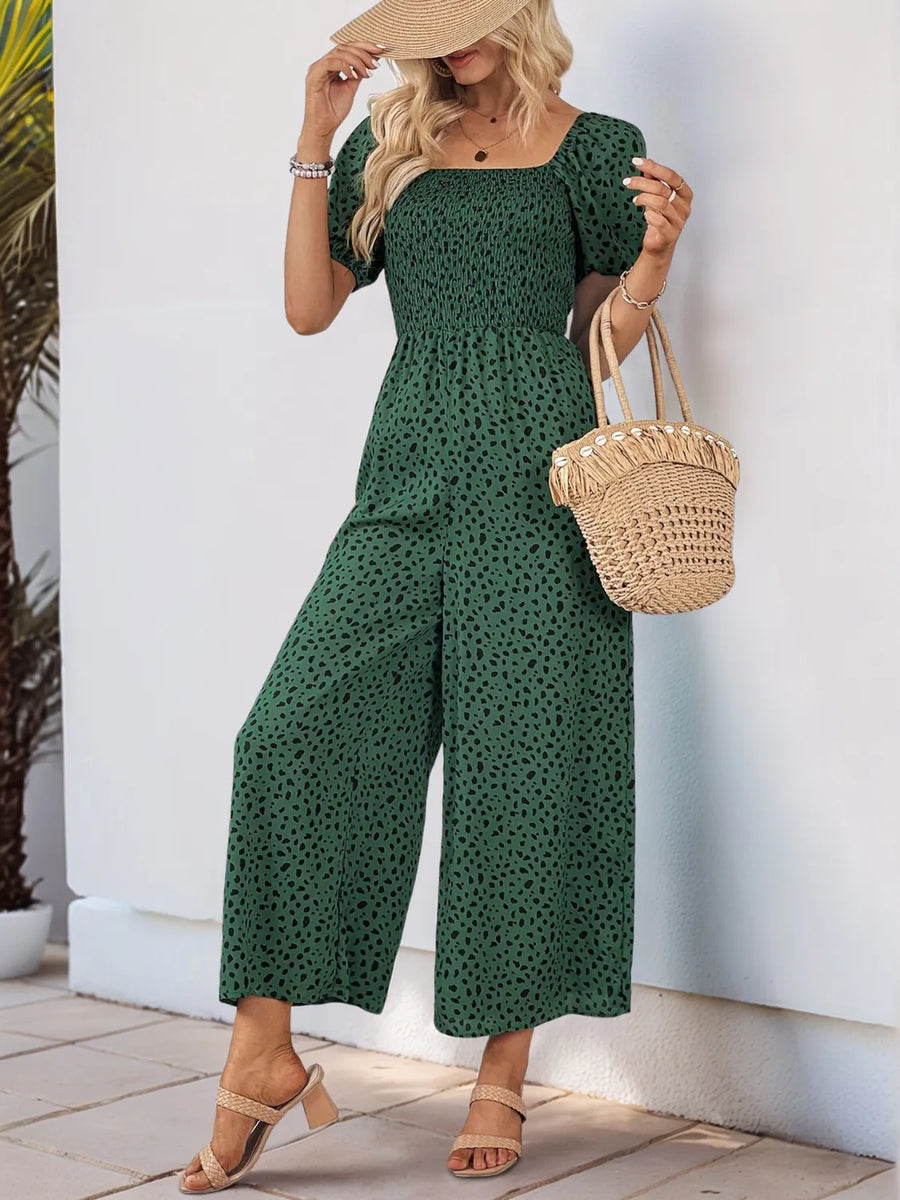 Dark Green smocked bodice jumpsuit with black leopard print, square neck, puff sleeves, and wide legs.