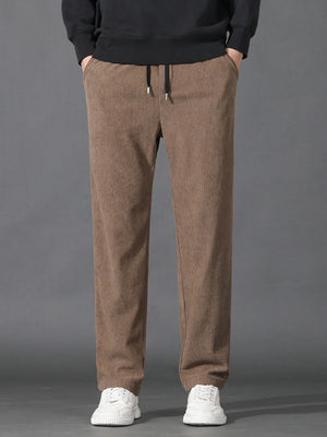Khaki corduroy joggers with drawstring waist and pockets.