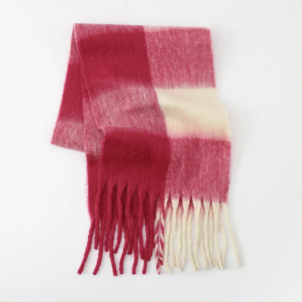 Checked plaid fluffy scarf in pink and cream with fringe details.