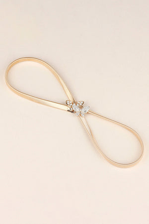 Gold metal belt with a crystal butterfly clasp detail