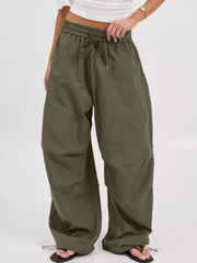 100% polyester Care instructions: Machine wash cold wide-leg pants in Army Green with loose silhouette