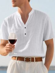 Relaxed-fit white band collar shirt with button detail, short sleeves, and a relaxed cut.