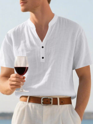 Relaxed-fit white band collar shirt with button detail, short sleeves, and a relaxed cut.