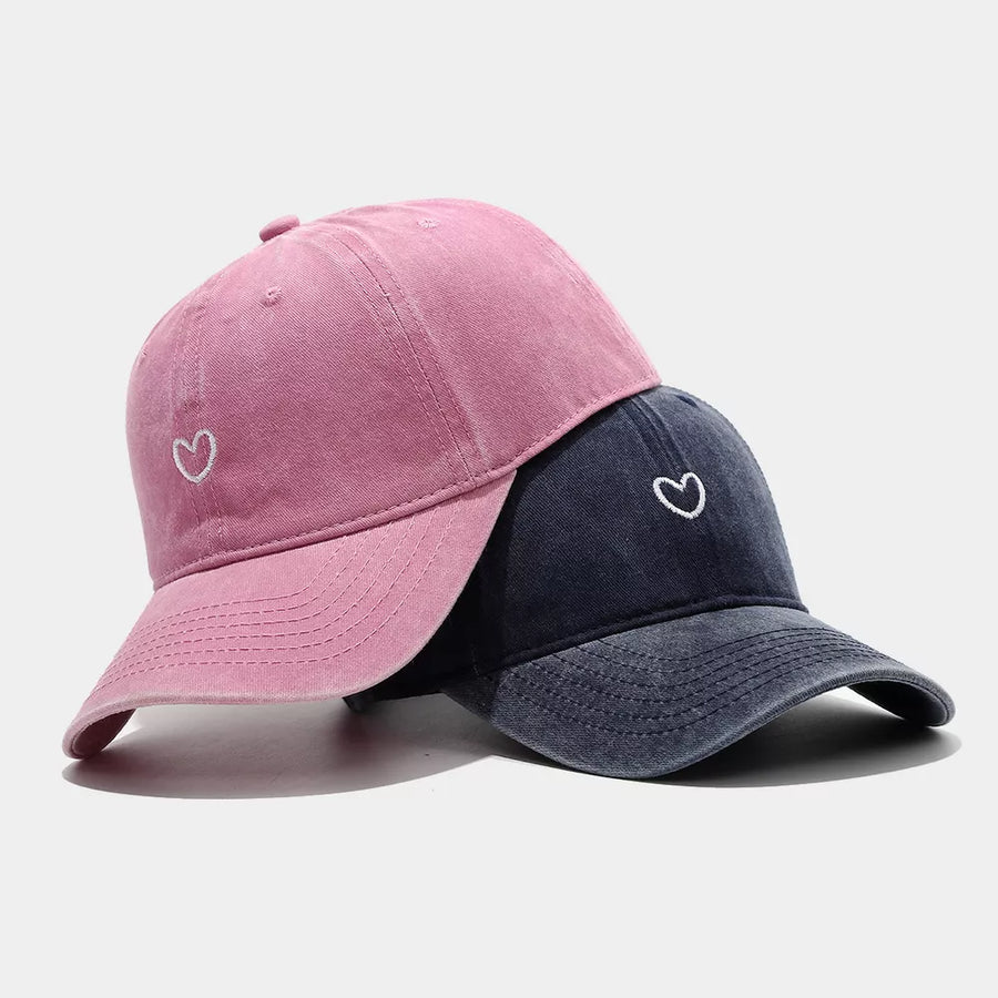 cap in faded pink featuring embroidered and structured fit