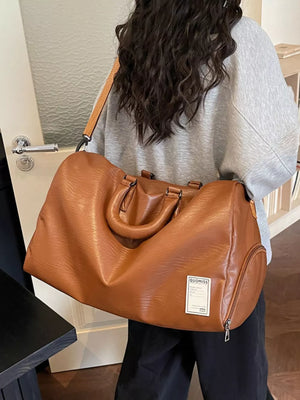 Brown pu leather travel bag with top handles and adjustable shoulder strap