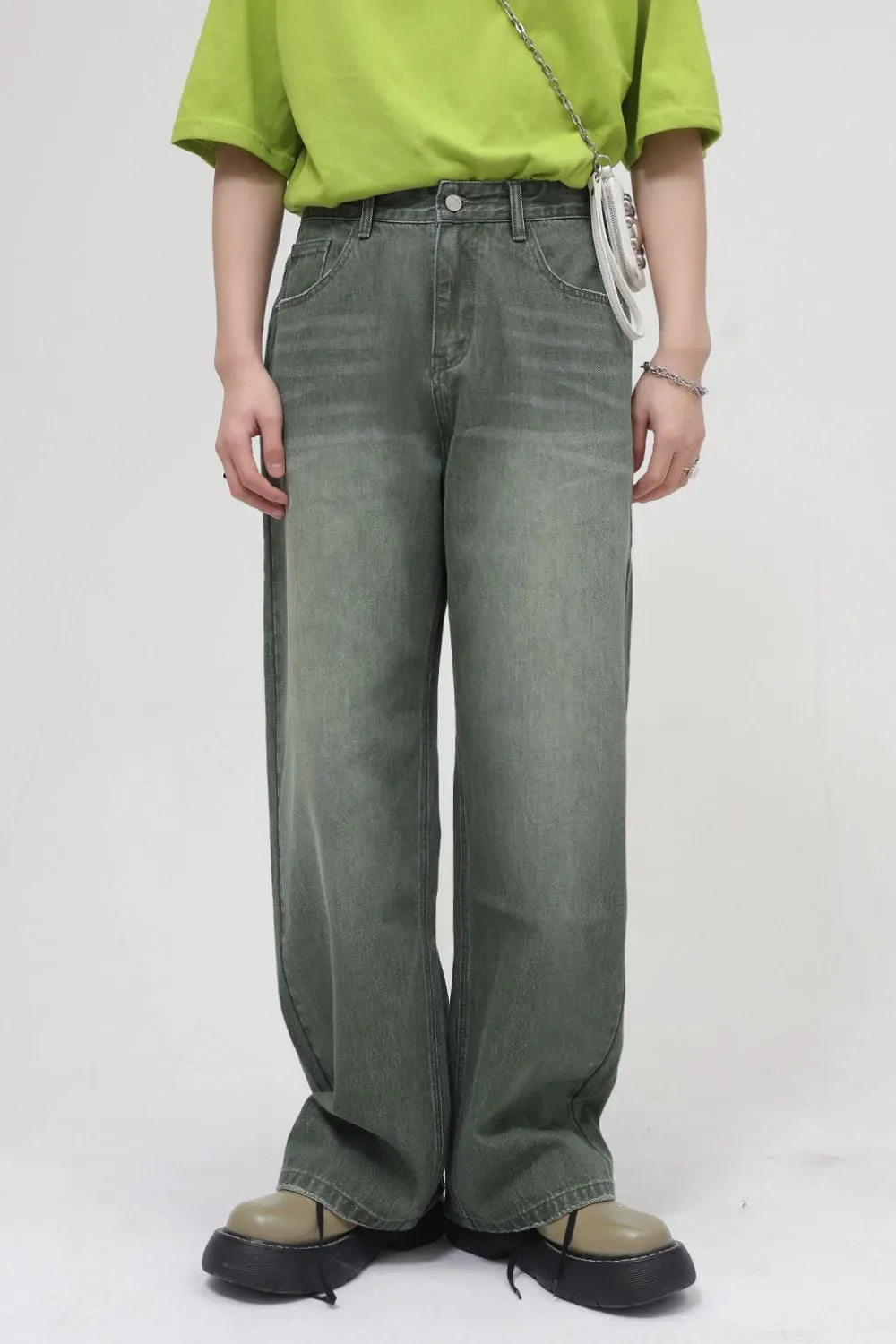 Faded olive wide leg denim jeans with a relaxed fit and classic five-pocket styling.