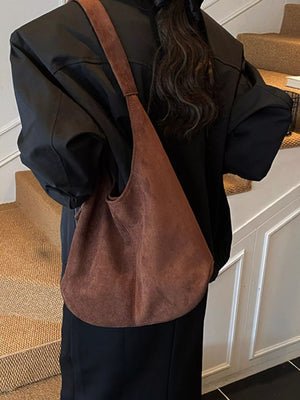 Large brown suede hobo shoulder bag with a slouchy silhouette and single strap.