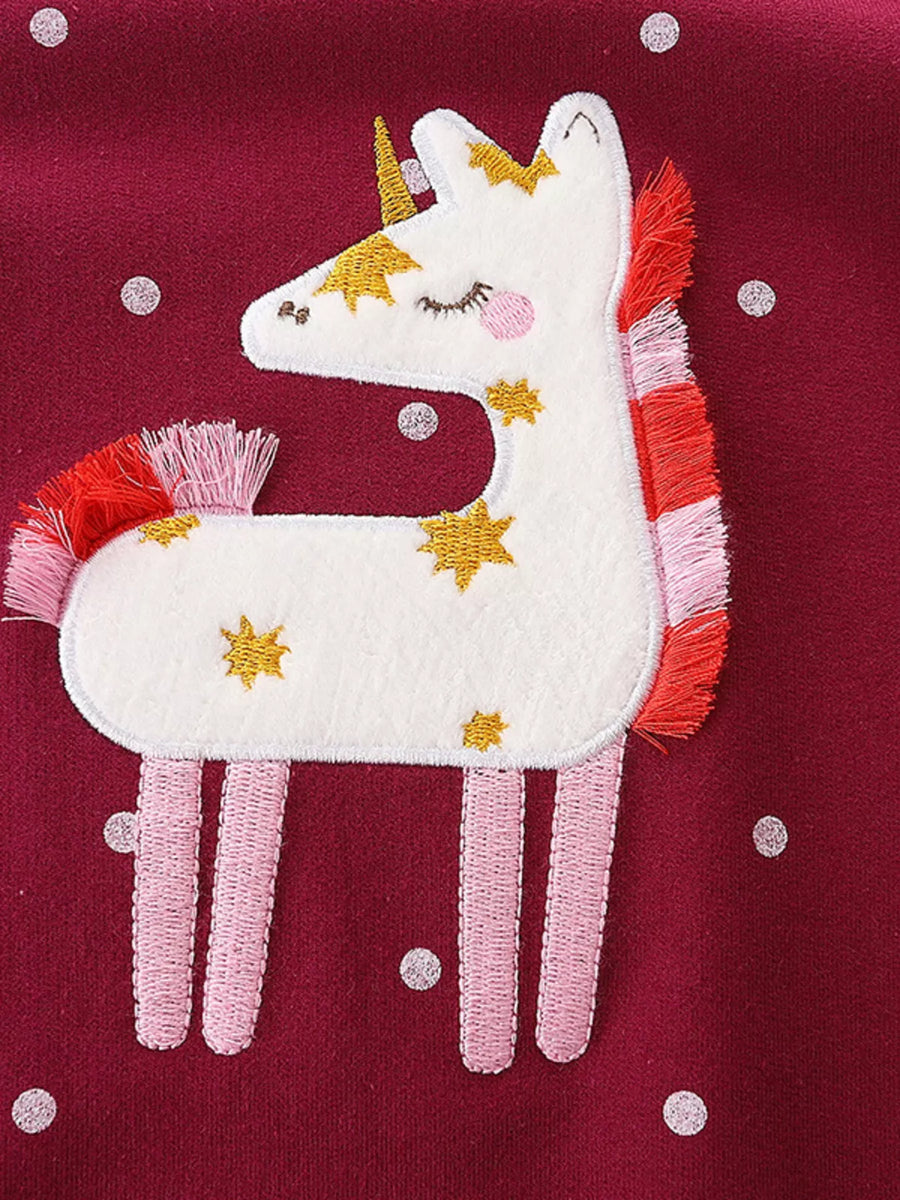 Burgundy baby sweatshirt with embroidered unicorn and stars detail.