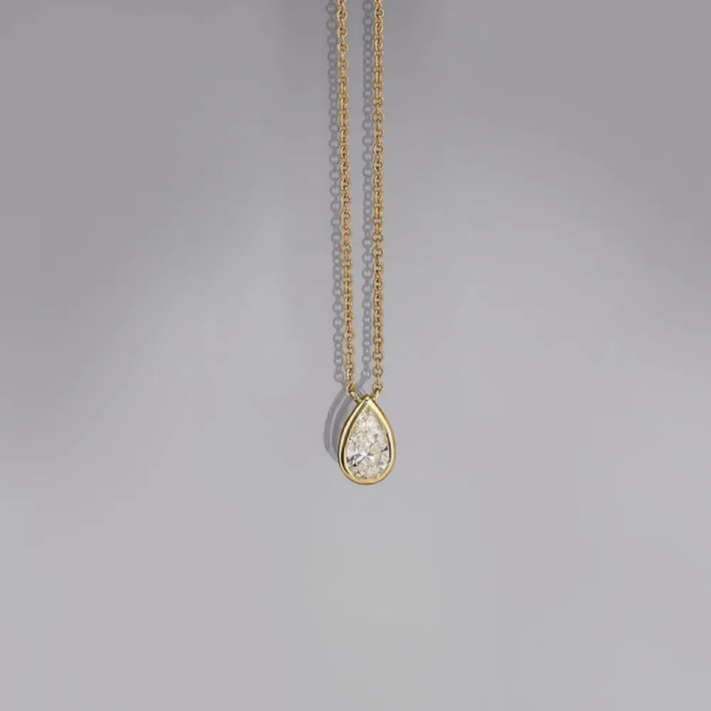 18K gold-plated necklace with bezel-set pear-shaped diamond pendant