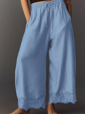100% polyester Care instructions: Machine wash cold wide-leg pants in White with loose silhouette