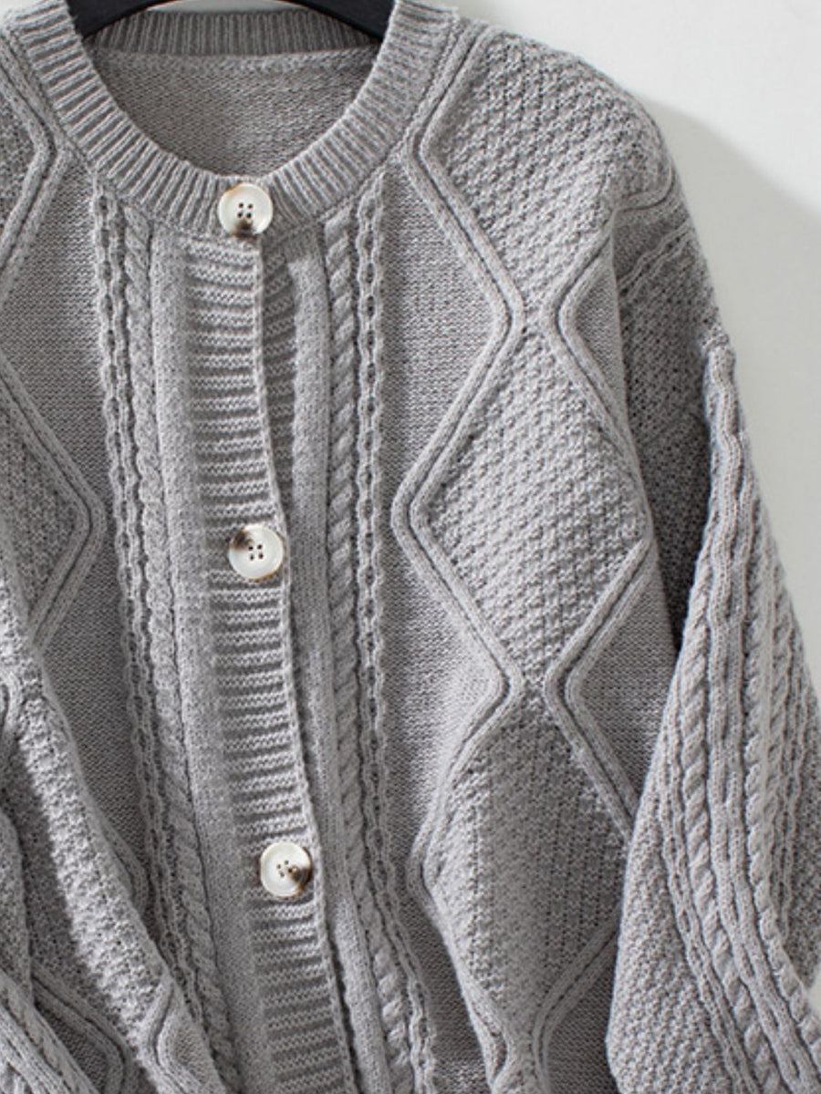 Gray cable-knit button-down cardigan with diamond and cable textures.
