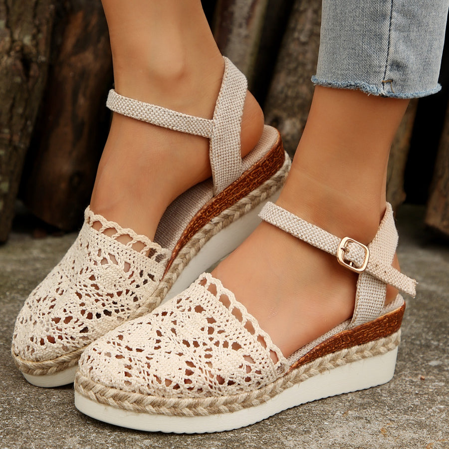 Ivory crochet espadrille wedge sandals with adjustable ankle strap and round toe.