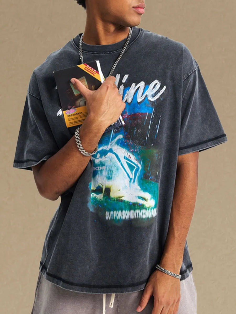 GraphiSleeve acid-washed black crew neck t-shirt with graphic print and distressed details.